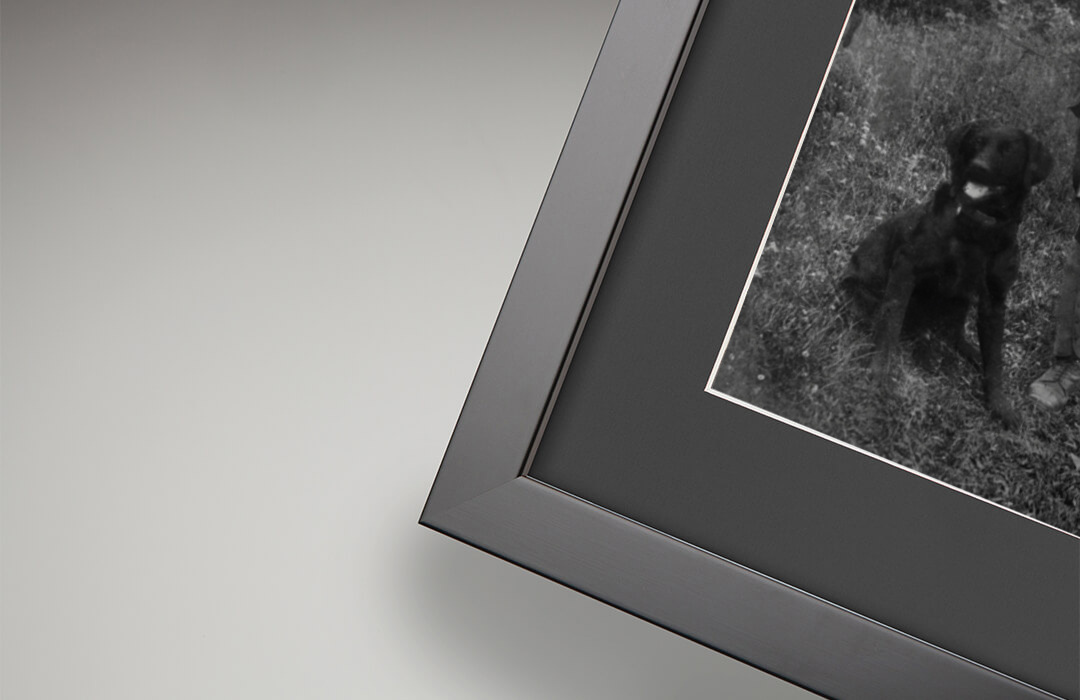 Black mount detail with restored photograph
